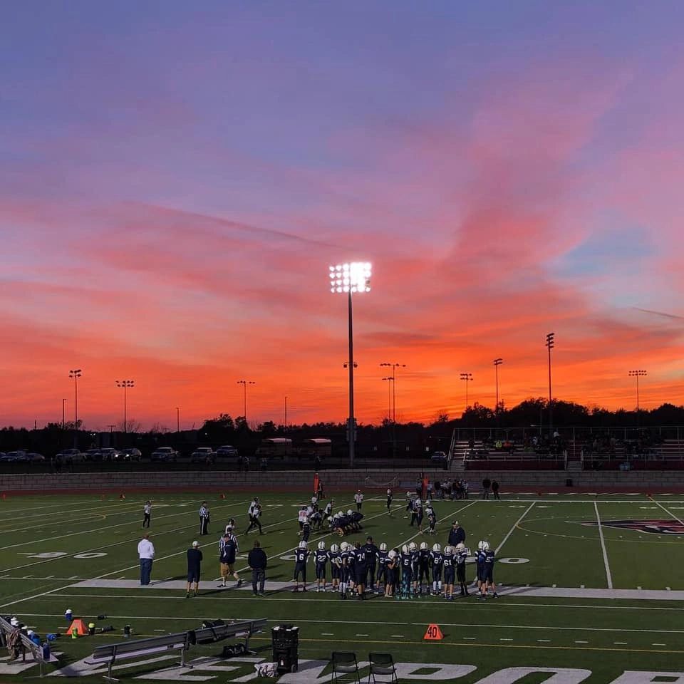 Sailor Youth Football team on field at sunset